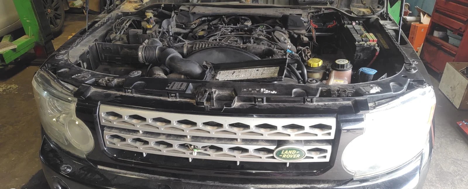 Land Rover engine bay open for inspection at iCarService workshop, Hyderabad